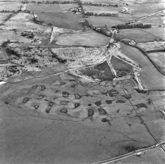 Dyke, Nappyfaulds and Strathavon, oblique aerial view, taken from the WSW, showing the area of open-cast mine at Dyke in the centre of the photograph, an area of rig in the top left, and Strathavon coal mines and coke ovens across the top.