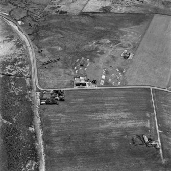 Hoy, Doonatown, oblique aerial view, taken from the NE, centred on The Garrison Theatre, Lyness Military Headquarters and Camp, and a ruined farmstead.