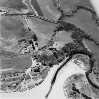 Red Castle, oblique aerial view, taken from the ESE, centred on the remains of Red Castle. The cropmarks of an unenclosed settlement and a barrow cemetery are visible in the top left-hand corner of the photograph, and a pillbox and anti-tank blocks are shown in the bottom left- and right-hand corner.