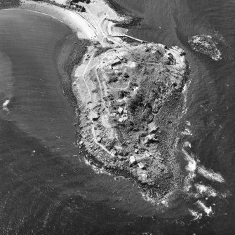 Scanned image of oblique aerial view, taken from the SE, centred on three coastal batteries.