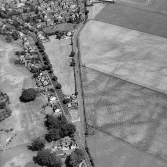 Curriestanes, oblique aerial view, taken from the WSW, looking across the cropmark of a cursus monument.