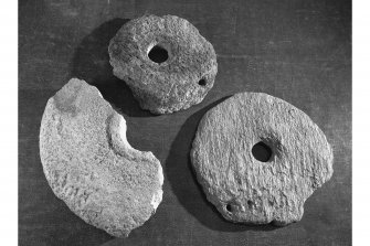 Rotary querns from crannog excavations.