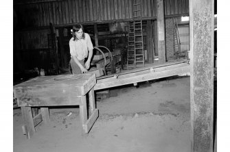 View of clay blocks on conveyer belt.