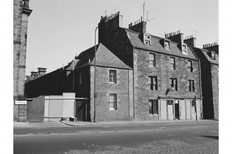 Edinburgh, 41-49 Holyrood Road, Tenement and Shop
View from S showing SE front of numbers 41-49 with maltings in background
