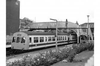 Falkirk, Grahamston Station
View frm E showing ESE front of footbridge with DMU train at platform