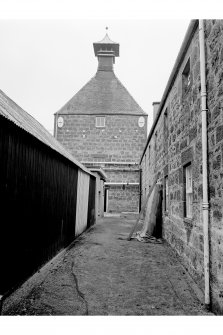 Longmorn Distillery
View from SSE showing SSE front of malt kiln (disused)