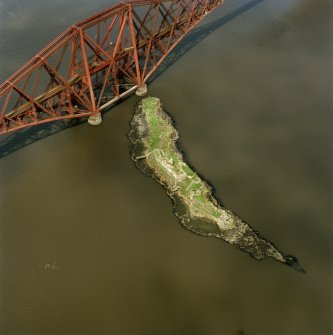 Oblique aerial view of The Forth Bridge and Inch Garvie centred on the rail bridge and the remains of a castle, battery, coast battery and artillery fortifications, taken in 1998.