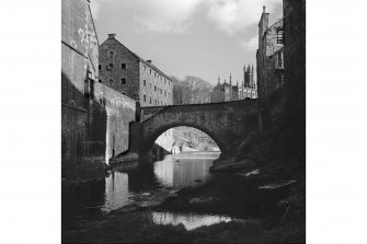 View from riverside of Water of Leith Bridge, West Mill (unrestored) and Holy Trinity Church