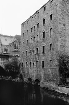 View of waterside elevation of West Mill, also showing Dean School