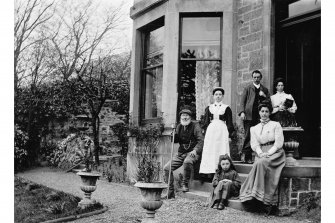 Group portrait at entrance door of 44 The Causeway, Edinburgh.
Inscribed with previous house name: 'no. 3 Hillside House, Duddingston, April 1909, J B W'