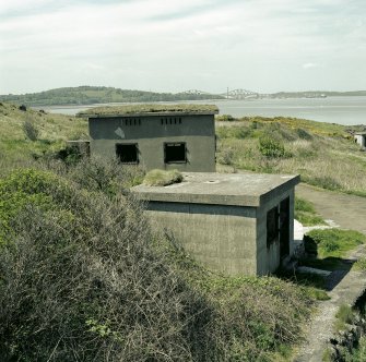 Scanned image view of gun battery engine house and magazine from the East.  Visible are ventilators and steel framed windows.