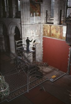 Steve Wallace, RCAHMS, on scaffolding photographing murals.