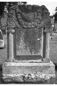 St Andrew's churchyard, North Berwick.
Alison Meek d. 1714 and Alexander Meek d. 1719.  Winged cherub at top, cornucopia and greenery beneath.  Inscription flanked by Ionic pillasters.