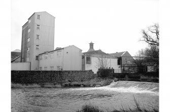 Windygates, Cameron Bridge Distillery
General view from W showing part of weir with distillery in background