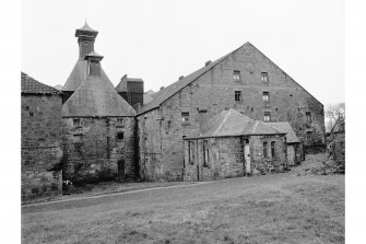 Windygates, Cameron Bridge Distillery
View from W showing SW and part of NW front of S malting block and SW front of W malt kiln with E malt kiln in background