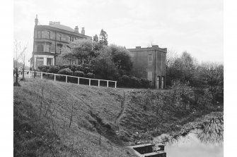 Kirkintilloch, Electricity Substation
View from N showing NNE and WNW fronts of substation with tenement and shop in background