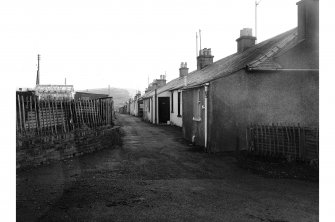 Dalmellington, 45-48 Burnton, Cottages
View from NW showing part of NE front of numbers 45 and 46, and part of NW front of number 45