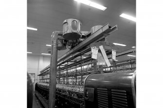 Paisley, Ferguslie Thread Mills, No. 3 Spinning Mill; Interior
View of an 'elephant', a self acting vacuum cleaner which runs above spinning machines in 3rd flat