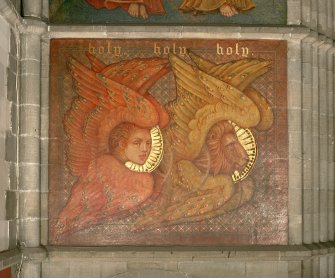 Interior. Detail of mural on of chancel arch, depicting the Evangelist symbols for Matthew and Mark.