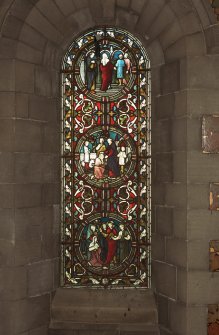 Interior. North chapel, view of stained glass window on east wall.
