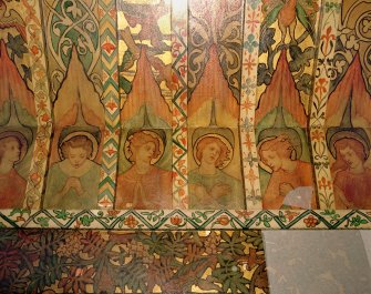 Interior. North chapel, detail of mural frieze depicting heads of angels.