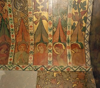 Interior. North chapel, detail of mural frieze depicting heads of angels.