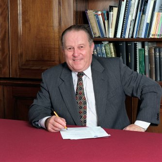 RCAHMS AT WORK.
Official photograph of Roger Mercer, Secretary of RCAHMS (1990-2004). Taken in his office.