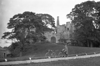 View of castle with boy on bicycle