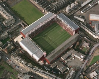 Oblique aerial view of Edinburgh centred on Tynecastle Park Stadium, taken from the SE.
