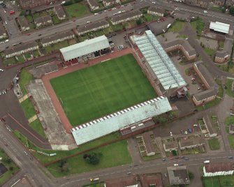 Oblique aerial view centred on St Mirren football stadium, taken from the NE.