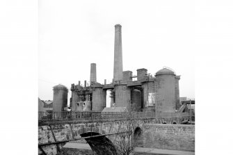 Larbert, Carron Ironworks
View from SE showing part of railway viaduct with blast furnaces in background