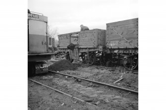 Larbert, Carron Ironworks
View of Carron wagon No. 755 being emptied prior to being loaed upon the back of a low loader