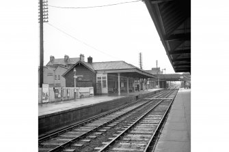 Falkirk, Grahamston Station
View from W showing WNW and SSW fronts of up platform building with lattice-girder footbridge in background