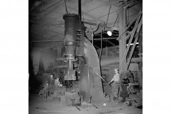 Coatbridge, 14 Jackson Street, Anderson's Engineering Works, Interior
View showing man working steam hammer
