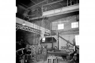 Coatbridge, 14 Jackson Street, Anderson's Engineering Works, Interior
View showing men working friction drive crane