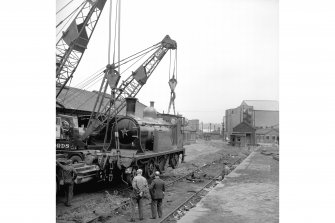 Glasgow, Govan Goods Yard
View from S showing cranes lifting locomotive number 123 with loading shed in background