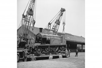 Glasgow, Govan Goods Yard
View from SE showing locomotive number 123 on trailer with loading shed in background