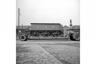 Glasgow, Govan Goods Yard
View showing locomotive number 123 tender on trailer with building in background