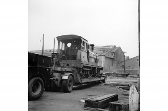 Glasgow, Govan Goods Yard
View from E showing locomotive number 49 on trailer with part of Glasgow Railway Engineering Works in background