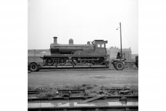 Glasgow, Govan Goods Yard
View showing locomotive number 49 on trailer with railway tracks in foreground