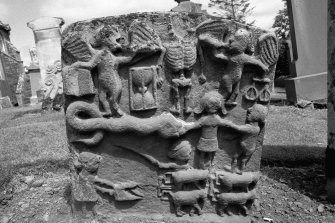 Colmonell churchyard.
Headstone commemorating Andrew McKissock, d.1754. Angels of Resurrection with an open book and scales flanking skeleton. Scene depicting the Fall of Man. Ploughing scene with a team of four oxen.