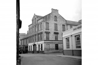 Kilmarnock, 8 East George Street, Elmslie Mills
View from SE showing SSW front and part of ESE front of mills with numbers 4-6 in background