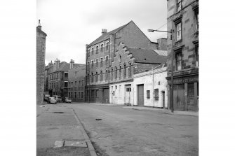 Glasgow, 49-55 Weir Street, Wire Weaving Factory
View from S showing WSW front of wire weaving factory with offices of Dock Engine and Boiler Works in background and cooperage in foreground