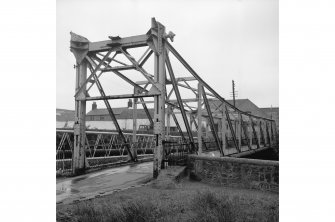 Paisley, Carlile Place, Footbridge
View from W showing WNW and SSW fronts of footbridge with gantry in background