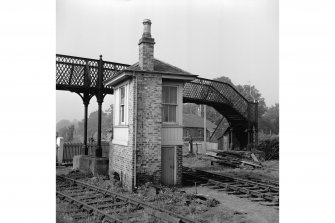 Edinburgh, Duddingston Road West, Footbridge and Signal Box
View from SE showing ESE and SSW fronts of signal box with part of footbridge in background