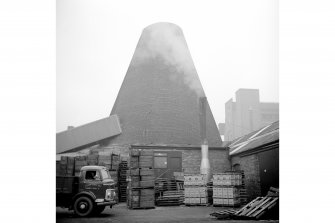 Alloa, Glasshouse Loan, Alloa Glass Works, Glass Cone
General view of works building and south glass cone showing extractor chimney at base of cone