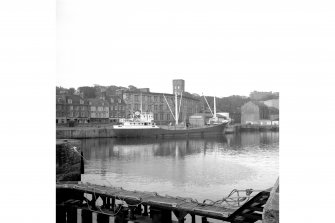 Kirkcaldy, Harbour
View from SSE showing German coaster in dock with numbers 467-479 High Street and works in background