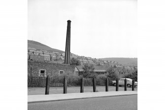 Galashiels, Low Buckholmside, Comelybank Mill
View from WSW showing chimney and part of mill with houses in background