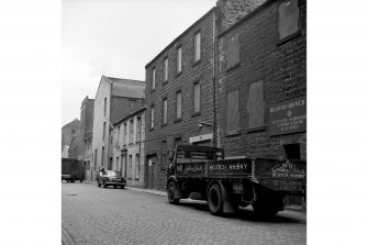 Edinburgh, 18-19 Mitchell Street, Warehouse
View from SE showing SSW front of numbers 18-19 with number 17 in background and part of numbers 20-28 in foreground