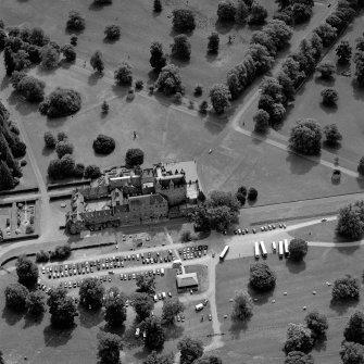 Oblique aerial view, taken from the NNW.  Garden features are visible as parchmarks.